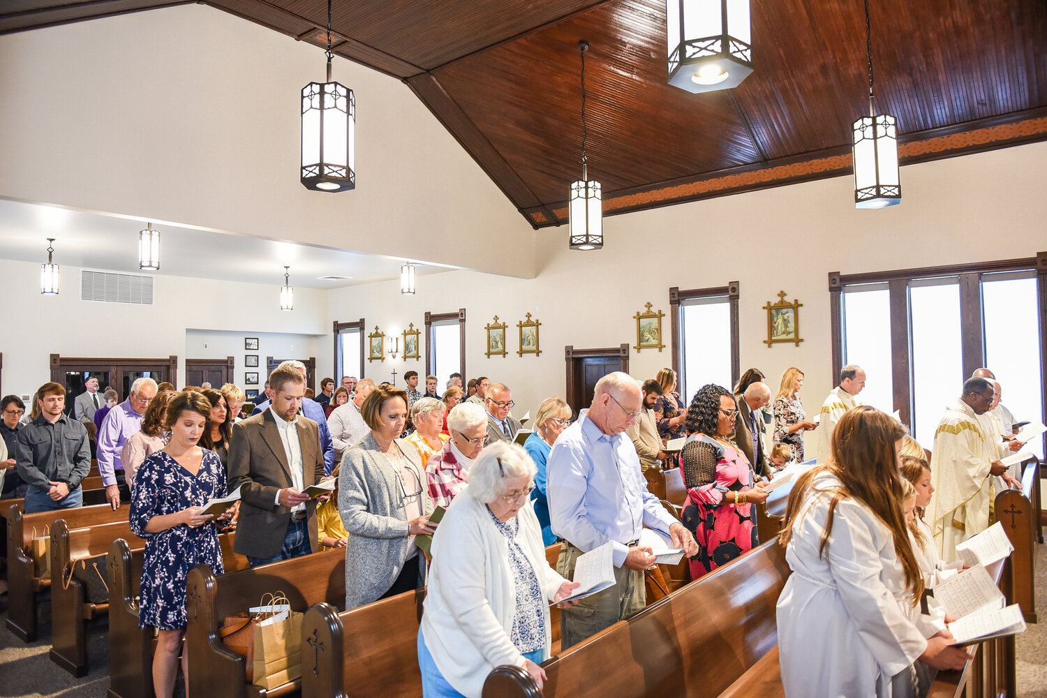 Members of St. Jude Thaddeus Parish in Mokane participate in the Rededication Mass for their church with Bishop W. Shawn McKnight on Oct. 22. The rededication capped a year’s worth of renovations to the 1895-vintage church. Photo by Annie Williams